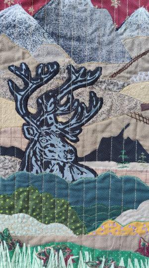 Poro tunturimaisemassa tilkkumaalaus